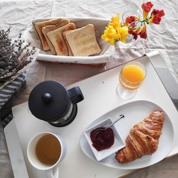 Pretty Breakfast was the theme of this shot featuring freshly squeezed orange juice, tea, croissant and toasted bread.