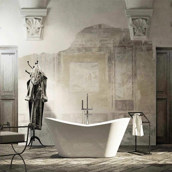 A white freestanding tub in a space with a neo heritage style vibe. Image: Viadurini.it.
