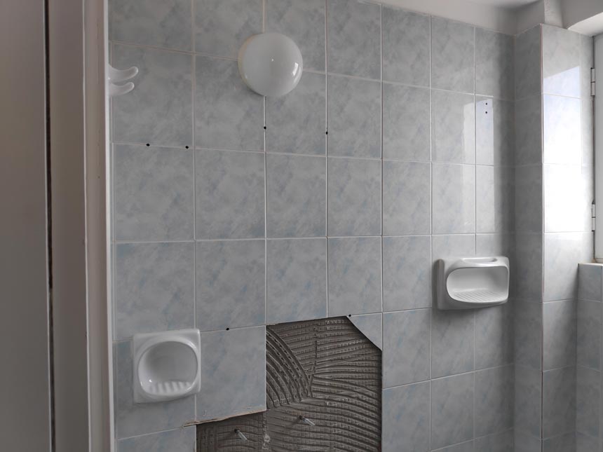 One of the top design crimes: no waterproofing. Here: An old bathroom with ceramic tiles where evidently there was no waterproofing layer under.