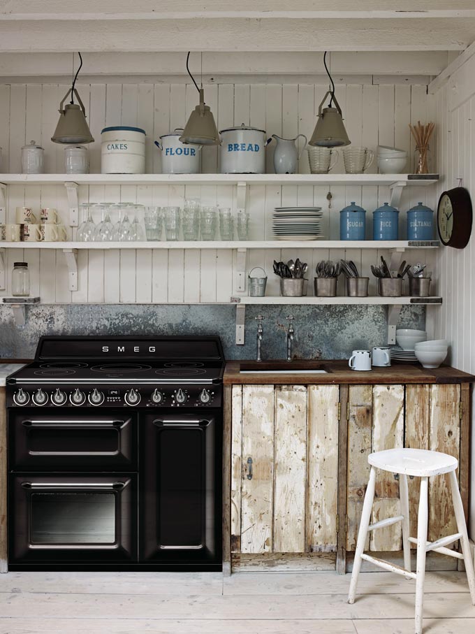 A rustic style industrial kitchen with open shelving and reclaimed wood cabinetry. Image: Harvey Norman.