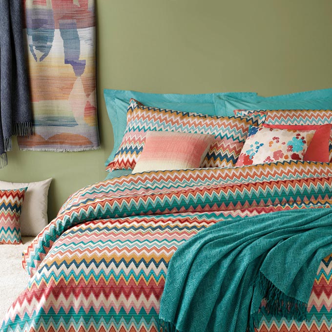 A bedroom with a colorful vibe, Missoni bedding via Amara.