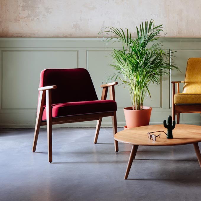 A Mid-Century inspired sitting lounge, featuring the 366 armchair. Via Lime Lace.