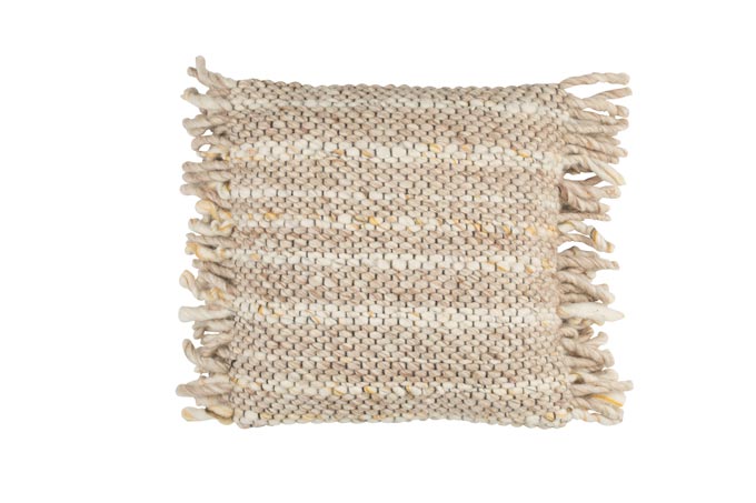 A textured pillow with side frills in beige. Via Rose and Grey.