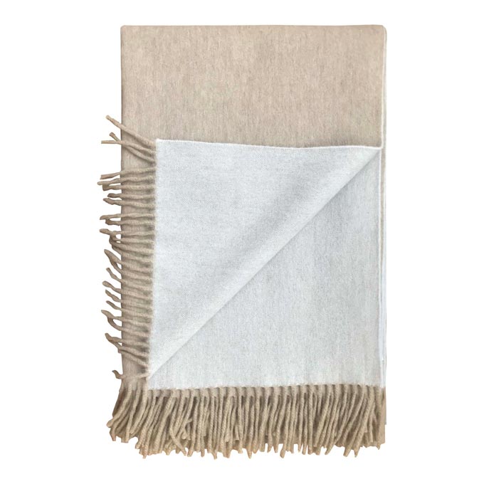 A luxurious reversible super soft Angora blanket in beige. Via The Fine Cotton Company.