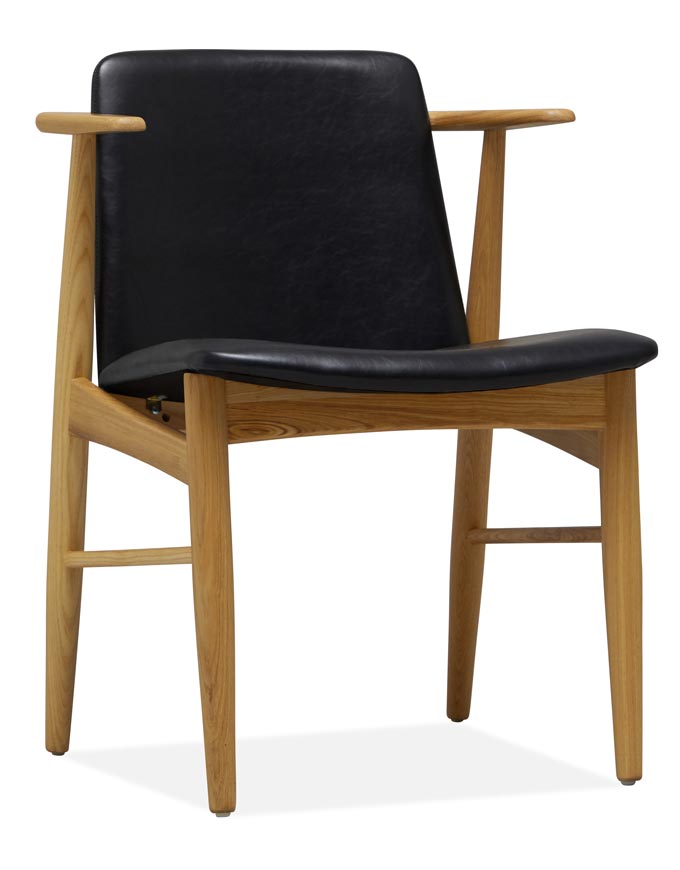 Cutout image of a Mid Century inspired dining chair with an upholstered black synthetic leather seat - Archie. Via Cult Furniture.