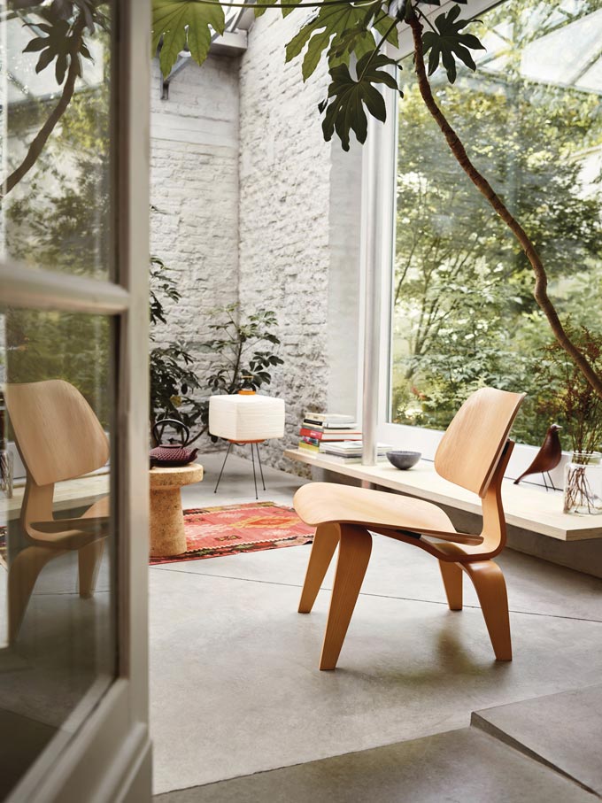 The Vitra LCW Eames Plywood chair - an iconic Mid-Century chair featured in a beautiful living space. Via Nest.co.uk.