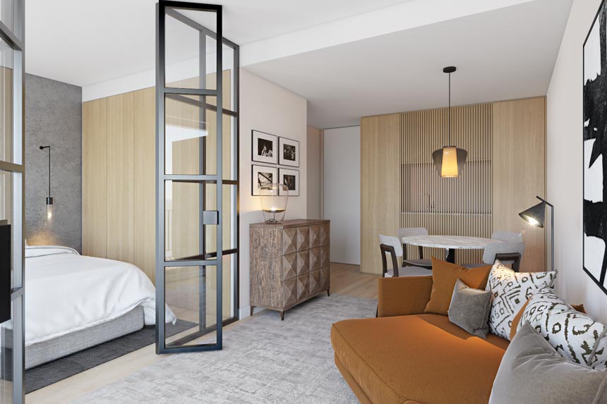 View of an open space apartment in Rio with a small sitting area, a bedroom, a dining area and a kitchenette hidden ingeniously behind wooden slats. The Antas Garden project was designed by Empatias studio.