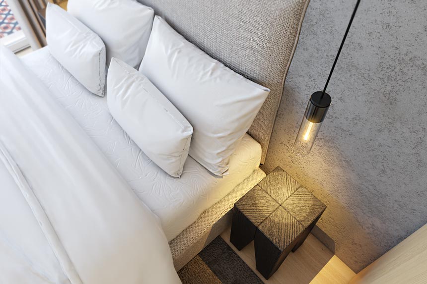 Detail from above of the bed with the bedside table from an open space apartment in Porto designed by Empatias studio.