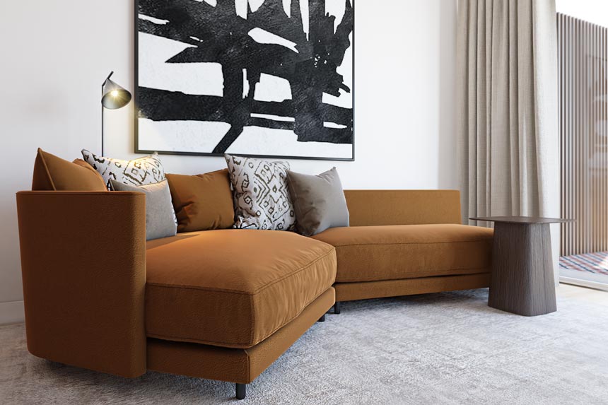 A terracotta curvy sofa with a large black and white artwork hanging over. Contemporary setting in an open plan space apartment in Porto designed by Empatias Studio.