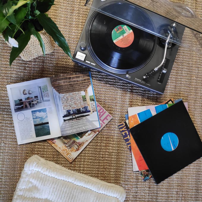 A flatlay image featuring a sisal rug from IKEA. Sisal rugs are ideal to use in a rental home. One of 7 tips for renters.