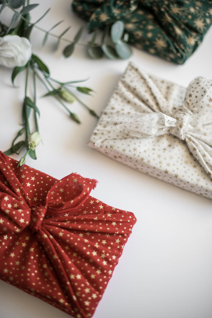 A flatlay of two items wrapped in the Furoshiki fabric gift wrap. Via Wrappuccino.