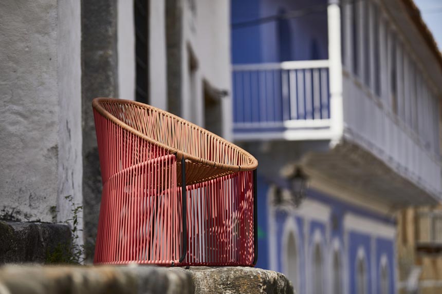 A lifestyle image of a textured colorful chair designed by Sebastian Herkner. Via: ames GmBH.