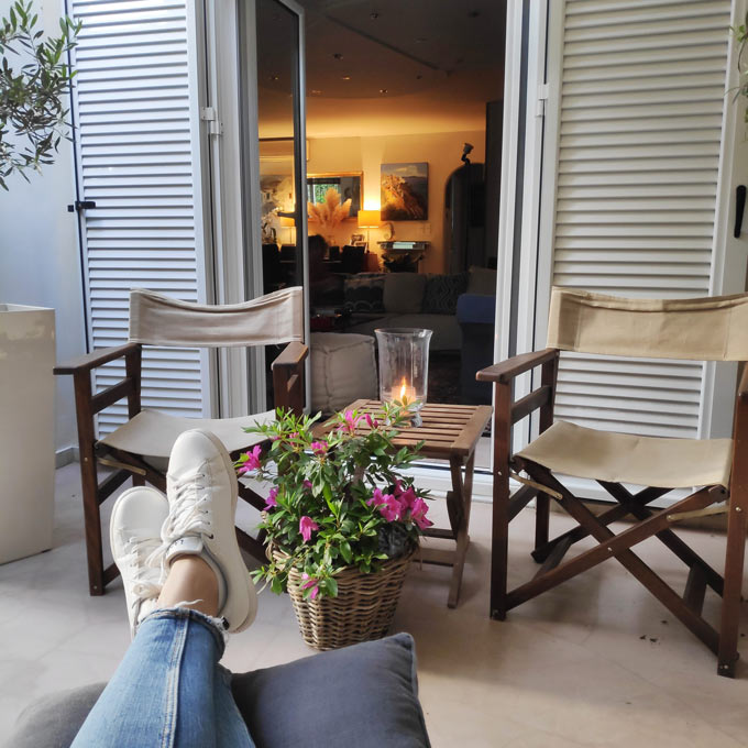 Partial view of a small outdoor space overlooking inside a home.