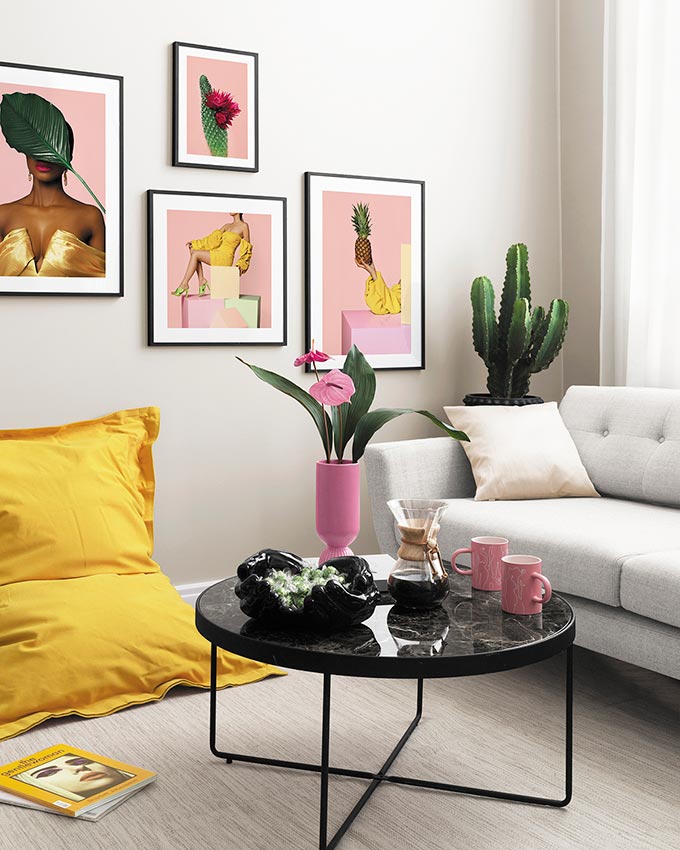 Such a cheery, bright sitting room with a dash of yellow and lots of pinks. Via: Desenio.
