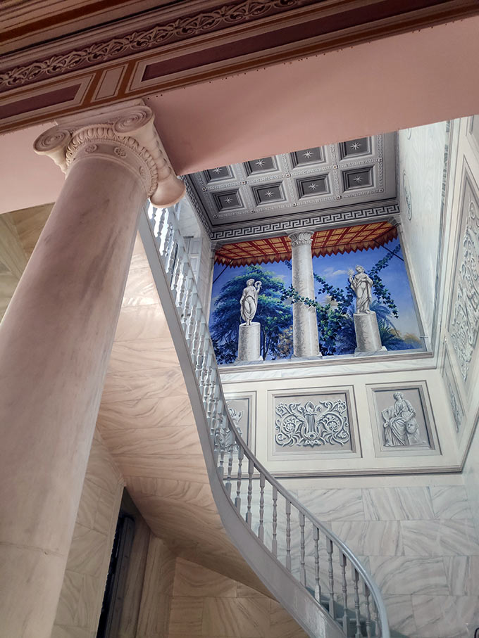 Partial view of the stairwell with its elaborate murals and Venetian stucco plastered walls. Image: Velvet Karatzas.
