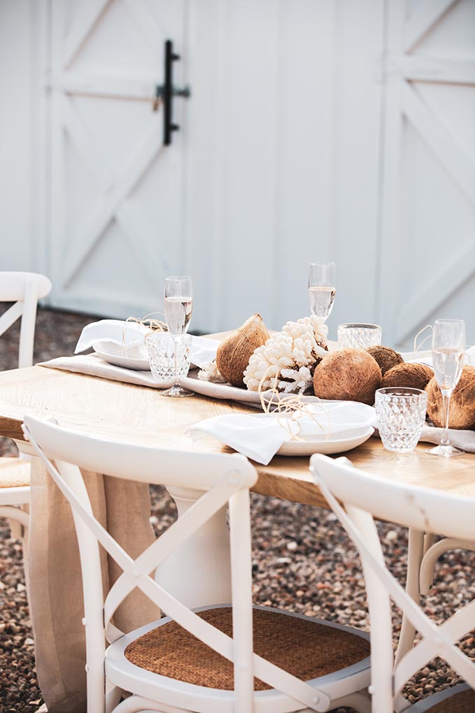 View of a outdoor dining table setup meant for a dinner party. Via OZ Design Furniture.