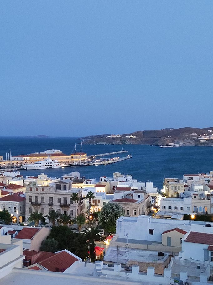 View of the port of Hermoupolis from above just after sunset hour.