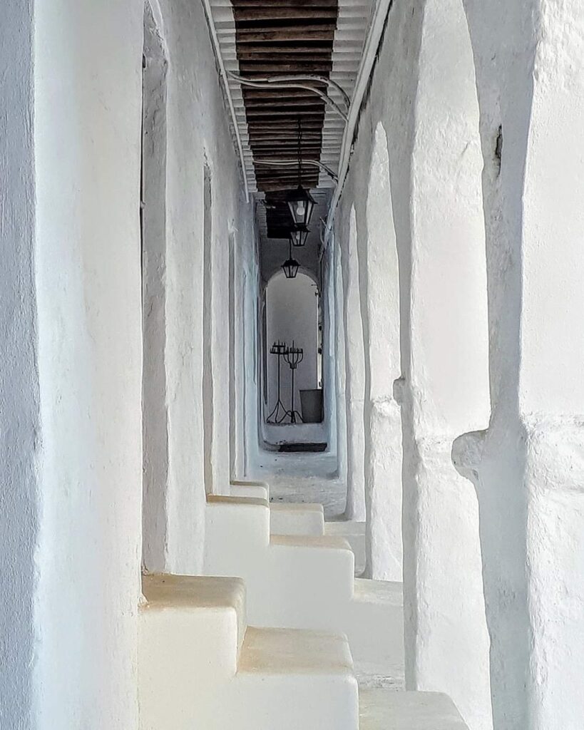 A pathway along series of arches at a chapel in Mykonos.