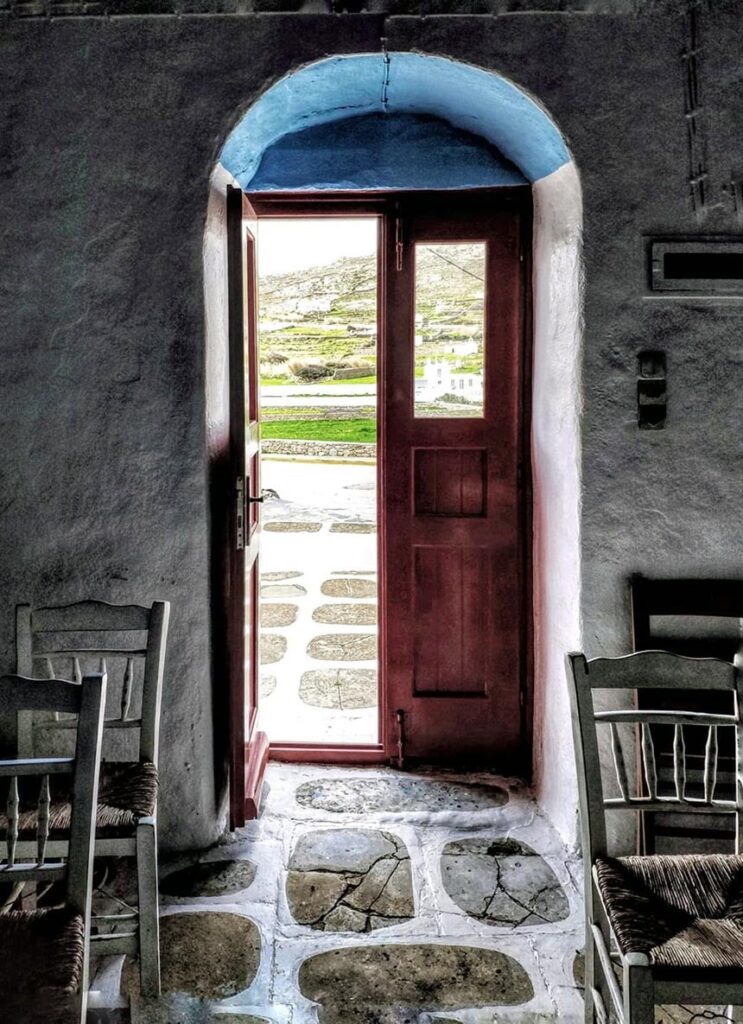 View of the inside of a chapel looking out.