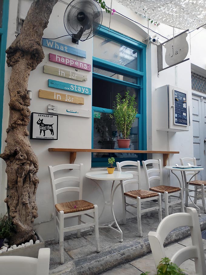 A small cocktail/breakfast bar in a narrow street alley of Hermoupolis, known as Jar.