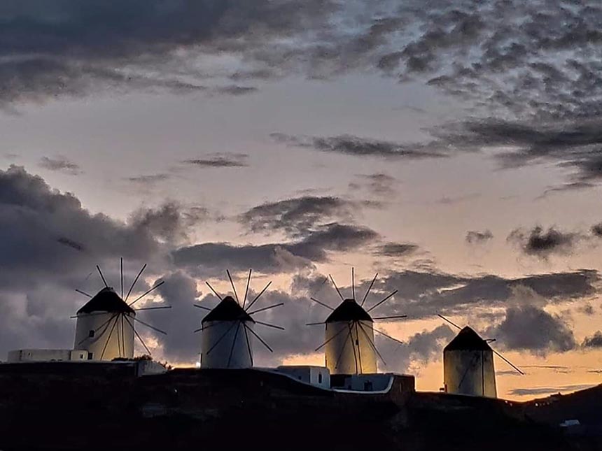 Four of the five 16th century windmills - a landmark in Mykonos, just after sunset.