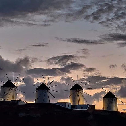 Four of the five 16th century windmills - a landmark in Mykonos, just after sunset.