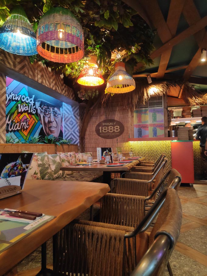 Partial view of the interior of a burger joint with a funky and vibrant vibe in Glyfada.