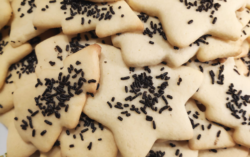 A pile of Velvet's Christmas Sugar Cookies.