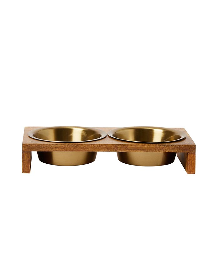 A raised stand with a pair of dog bowls from Oliver Bonas. A stylish gift for your four-legged best friend.