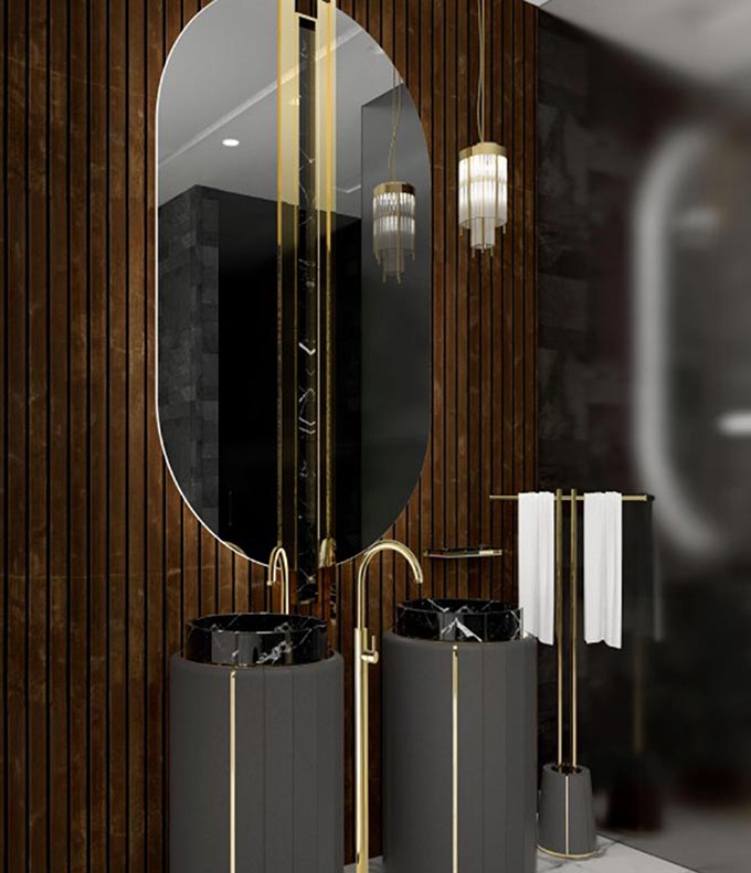 A moody opulent bathroom with an oversized curvy mirror, two black washbasins and a free standing towel rack. Image: Maison Valentina.