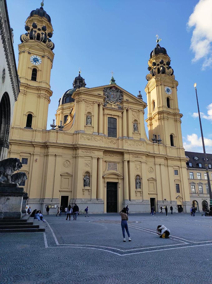 One of the landmark churches of Munich: Theatinerkirche with its distinctive yellow facade.