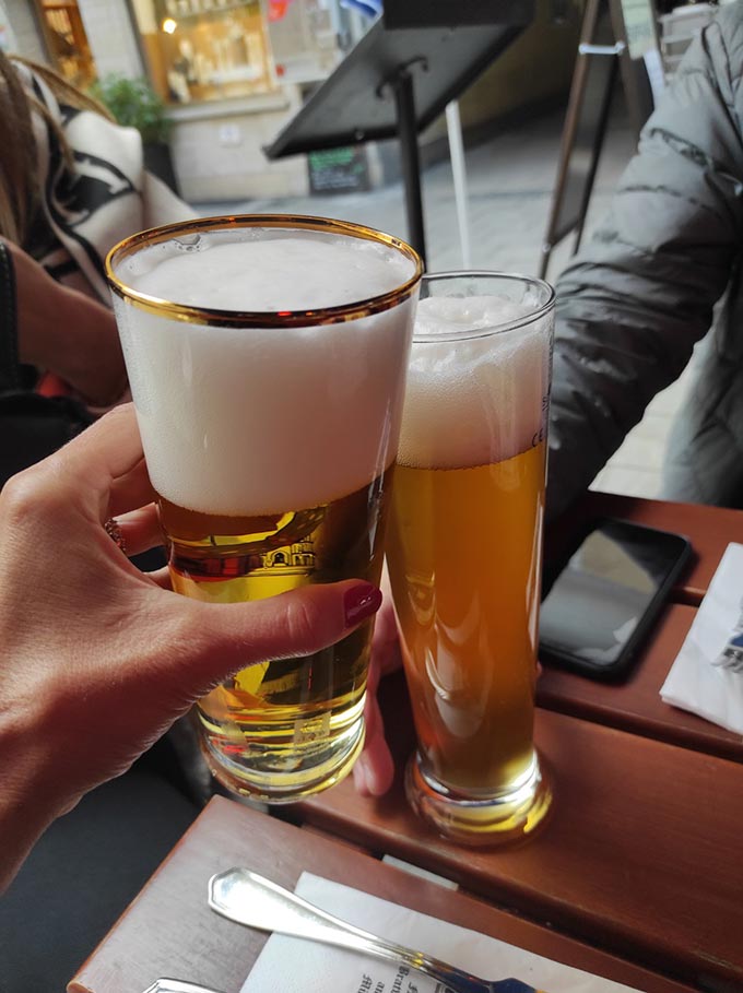 Two people drinking beer.