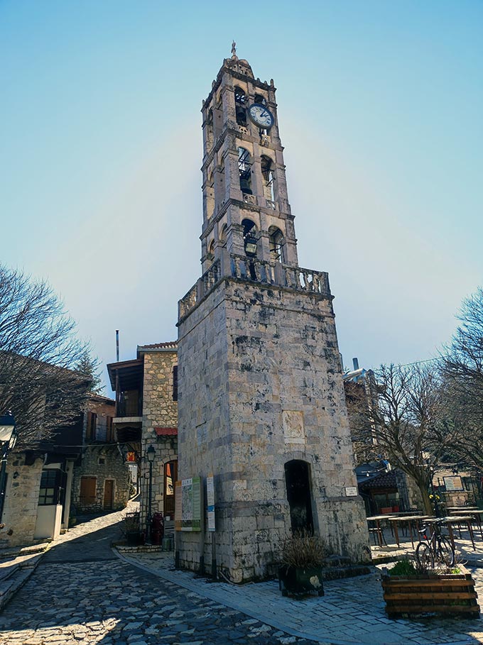 An old stone clock tower in the square of the village Stemnitsa.
