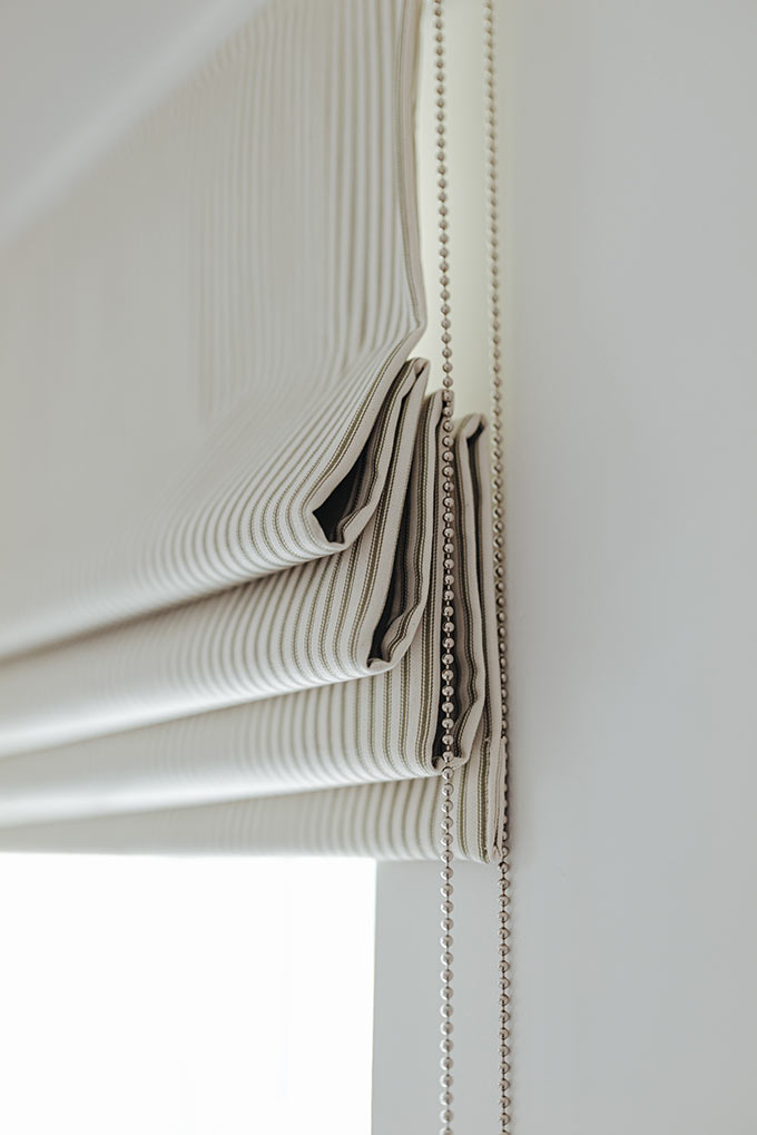 Close up detail of a striped Roman shade. Image: Stitched.co.uk.