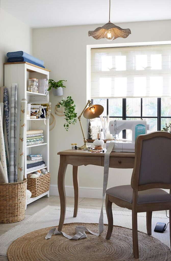 A stylish workshop room with a roller blind as a window treatment. Image: Dunelm.