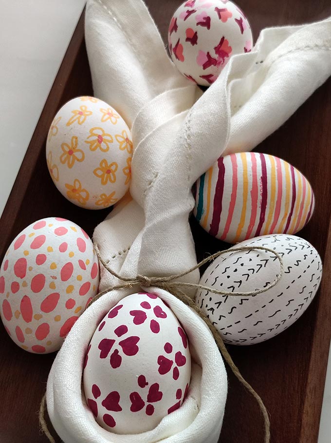 Five DIY decorated Easter eggs, but one dressed as a bunny!