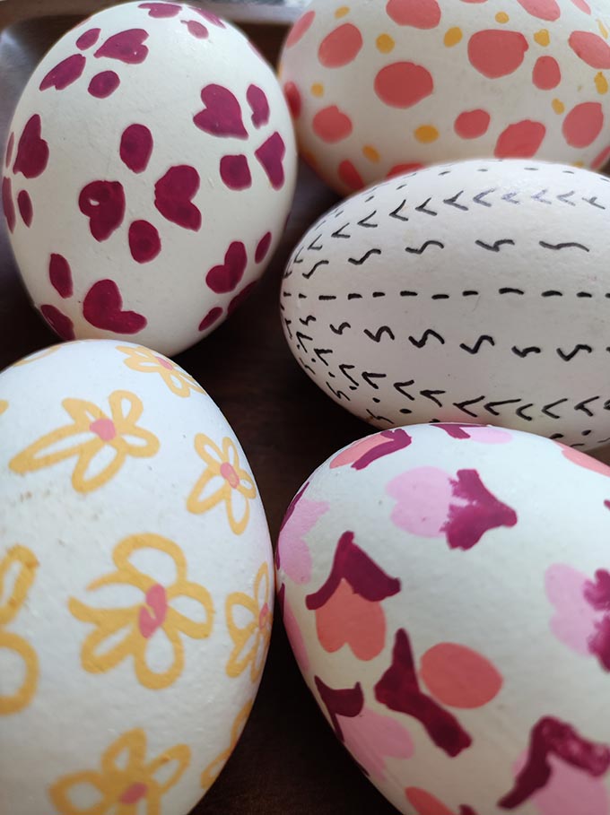 Five DIY hand painted Easter eggs closeup