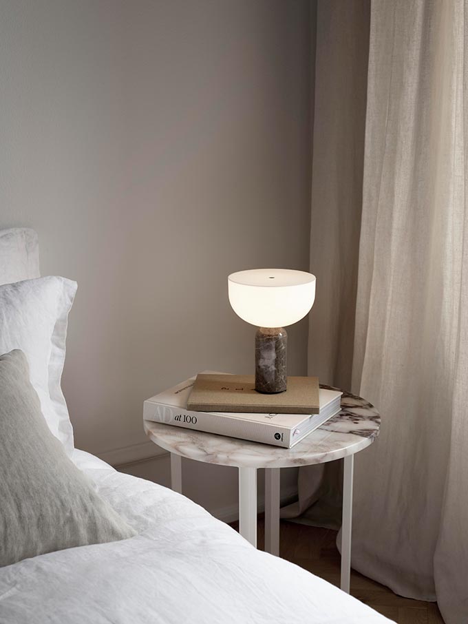 The New Works Kizu table lamp on a bedside table. Image: Nest.co.uk.