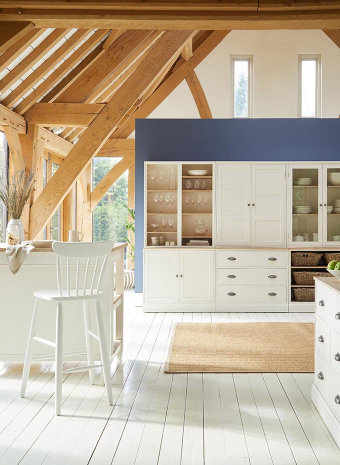 A beautiful white kitchen with glass door cabinetry by Dunelm. Image: Dunelm.