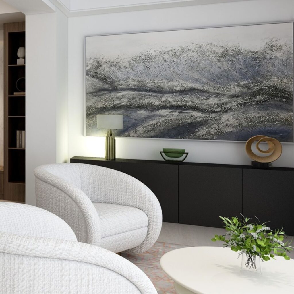 Contemporary off-white sitting room with a dark wooden sideboard in the background and a large accent artwork. Image copyright: Velvet Karatzas IDA.