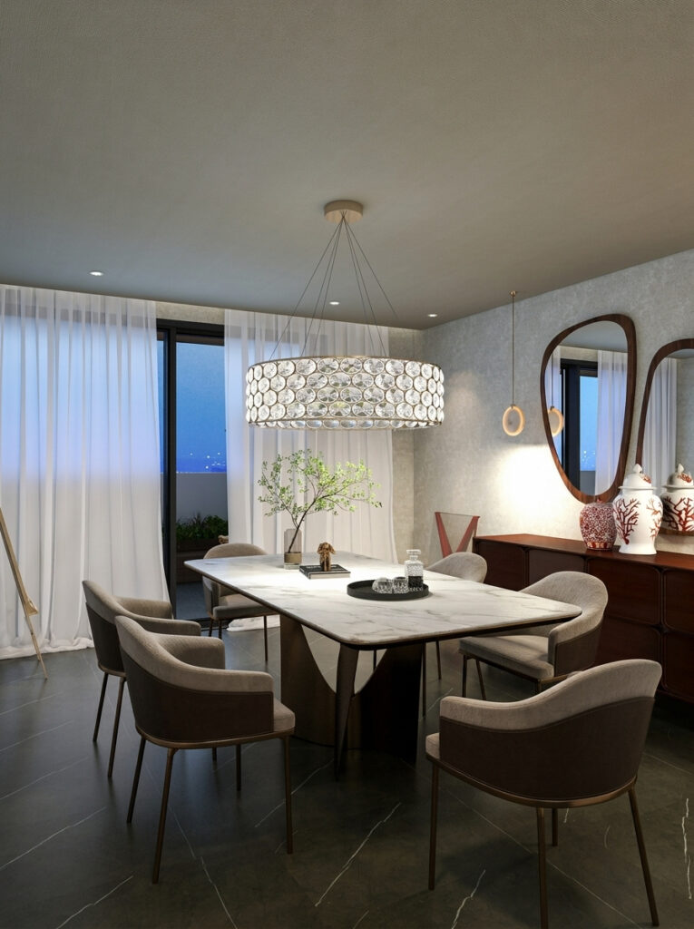 A contemporary dining space with a red laquered sideboard, two mirrors atop, a round crystal, modern chandelier at after sunset hours. Concept by Velvet Karatzas IDA.